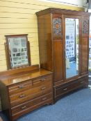 CIRCA 1910 TWO PIECE MAHOGANY BEDROOM SUITE of single mirrored door wardrobe with carved detail to