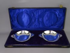COLONIAL SILVER DISHES, a boxed pair, with shallow bowls and double handles in Art Deco form, c1920,
