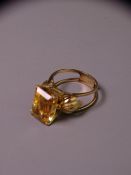 14CT GOLD CITRINE DRESS RING with emerald cut faceted citrine, approximately 12.5 x 8.7mms and the