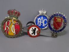UK & SPAIN RAC BADGES and other Automobile Club badges for Rome and Berlin, mainly mounted on a