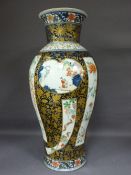 JAPANESE (CLOBBERED) 19TH CENTURY VASE - gilt decorated over panels of people, animals and flora,
