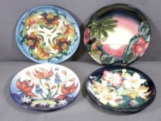 MOORCROFT - four boxed commemorative dated plates, 1999 - 2002, 22.5cms diameter