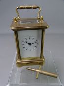 FRENCH MINIATURE BRASS CARRIAGE CLOCK, white enamel dial set with Roman numerals, key included,