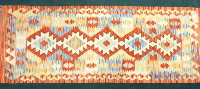 VEGETABLE DYE WOOL CHOBI KILIM RUNNER - vibrant stylized multicolour pattern within a double border,