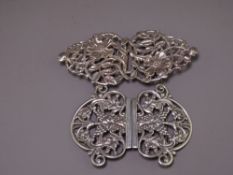 SILVER NURSES' BUCKLES (2), one ivy and berries design, London 1986, one briar roses design,