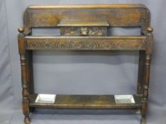 CARVED OAK HALL STICK STAND, reduced height with lion mask central drawer and turned front