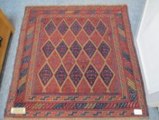 RED GROUND CAZAK RUG - triple bordered with multiple diamond central block, 122 x 120cms