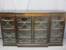 MAHOGANY FOUR DOOR BREAK-FRONT BOOKCASE, edge carved decoration to the top of 13 pane astragal