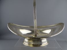 BOAT SHAPED SWING HANDLED BREAD BASKET, London 1913, Makers Goldsmiths & Silversmiths Company, 30cms