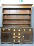 CIRCA 1840 NORTH WALES BREAKFRONT DRESSER in oak and pine, the three shelf rack with wide backboards