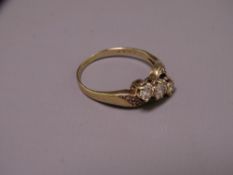 9CT GOLD THREE STONE DIAMOND RING, size mid O - P, crossover style setting with tiny diamonds to the