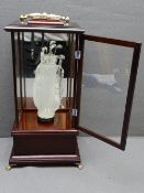 GOLFING INTEREST DISPLAY, a glass form golf bag containing clubs, in a mirror- back glass and