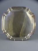 SILVER SALVER, Sheffield 1939, Maker Emile Viner, 26.5cms sq with raised edge on four curled feet,