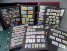 WORLD STAMPS - superbly presented in four volumes including transport, land, sea and air,