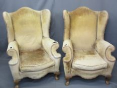 GOOD VINTAGE PAIR OF WINGBACK ARMCHAIRS having swept arms and serpentine front seat on carved knee