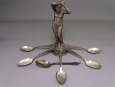 CAST LEAD FIGURINE OF A NAKED FEMALE and six German silver teaspoons, stamped 'W N F 90', 3.7 troy