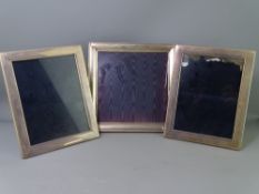 THREE MODERN SILVER PHOTOGRAPH FRAMES, 24.5 x 24.5cms single and 24.25 x 19.25cms pair, all with