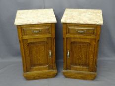 PAIR OF CONTINENTAL OAK MARBLE TOP BEDSIDE CABINETS, 73.5cms H, 40.5cms W, 39cms D