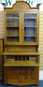 OAK ARTS & CRAFTS SECRETAIRE BOOKCASE, the twin glazed door top section with interior adjustable