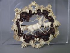 UNUSUAL FINELY CARVED VICTORIAN ANTLER BROOCH with stag and deer scene surrounded by ferns