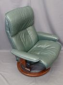 'STRESSLESS' SWIVEL ARMCHAIR by Ekornes, Norway, modern green leather effect with closed arms,