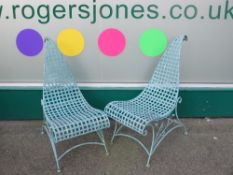 PAIR OF GREEN METAL GARDEN CHAIRS, interesting swept scroll seats and back, 92cms H, 45cms W,