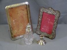 SILVER ITEMS - two portrait frames, silver topped sugar sifter and a short candleholder