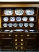 CIRCA 1840 NORTH WALES BREAKFRONT DRESSER in oak and pine, the three shelf rack with wide backboards