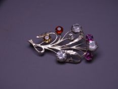 UNMARKED WHITE METAL FLORAL SPRAY BROOCH, single sapphire 0.35 carat, cubic zircon and colourful