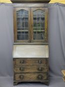 VINTAGE OAK BUREAU BOOKCASE, twin leaded glass upper doors over a fall front with fitted interior