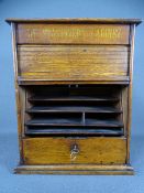 WOODEN DESKTOP STATIONERY CABINET having roller shutter front and drawer with contents