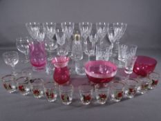 GLASSWARE - a quantity of drinking glasses, cranberry glassware ETC