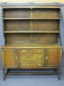 CIRCA 1930 OAK DRESSER with two shelf rack over a base section of three central drawers and flanking