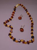 AMBER BEAD NECKLACE of natural form and a pair of earrings