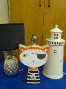 TABLE LAMPS - three novelty including 'Pineapple', Light House' and 'A Wooden Cat' by Lesley