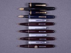 WATERMAN - Two vintage 1947/8 maroon Waterman Crusader Taperite fountain pens with 14ct gold nibs,