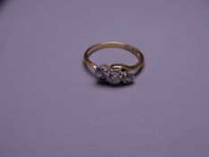 EIGHTEEN CARAT GOLD THREE STONE DIAMOND RING, 0.50 carat central stone with two further 0.20 outer