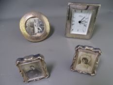 THREE SILVER PHOTOGRAPH FRAMES and a modern clock stamped 925, the 11cms D circular frame,