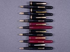 WATERMAN - Two vintage (late 1940s) Waterman Taperite fountain pens - one black, one maroon - with