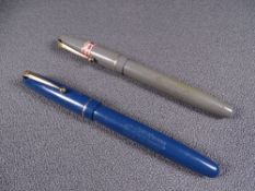 MABIE TODD - Two vintage 1940s Swan Mabie Todd self-filler fountain pens with gold trim and 14ct