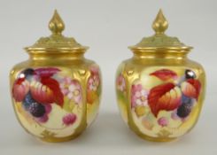 TWO SIMILAR ROYAL WORCESTER POT POURRI VASES AND COVERS hand painted with autumnal berries and