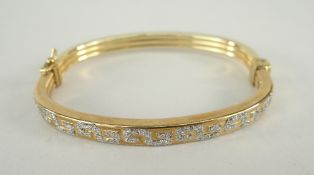 9CT YELLOW GOLD BANGLE with Greek Key design decoration, 9.6grams