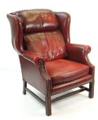 GEORGIAN STYLE LEATHER UPHOLSTERED WING-BACK ARMCHAIR