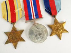 WWII MEDAL TRIO COMPRISING 1939-45 War medal, Africa Star and 39-45 Star in box marked G H Wells
