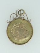 9CT YELLOW GOLD FLORALLY ENGRAVED PENDANT in 9ct gold mount, 3.6gms