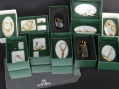 ELEVEN SWAROVSKI CRYSTAL 'MEMORIES GOLD SPORT' ORNAMENTS WITH MIRROR, BOXED (11)