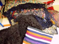 ASSORTED TEXTILES including two rag rugs, two flat weaves, four cushions and camel bag face