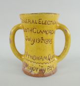 MUSTARD GLAZED EWENNY POTTERY TWIN-HANDLED MUG inscribed 'General Election, South Glamorgan, July