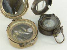 TWO ENGLISH BRASS MILITARY COMPASSES, one by Stanley of London mark 1941 for The Navy, the other