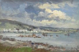 IAN HOUSTON (b.1934) oil on board - view across bay, entitled verso 'Sunlight Through Clouds Macau',